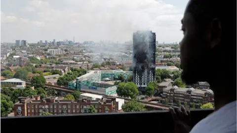 Getty Images Man looking at tower