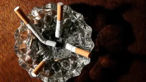 PA Media cigarettes in ash tray