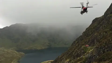 Aberdyfi Search and Rescue team  Search and rescue teams recover a man's body from Cader Idris