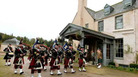 PA Media The Prince of Wales, known as the Duke of Rothesay when in Scotland, watches the Pipes and Drums of the 7th Battalion, The Royal Regiment of Scotland at a ceremony to present service medals to soldiers from the 51st Highland, 7th Battalion, The Royal Regiment of Scotland in the grounds of Birkhall in Ballater, Aberdeenshire.