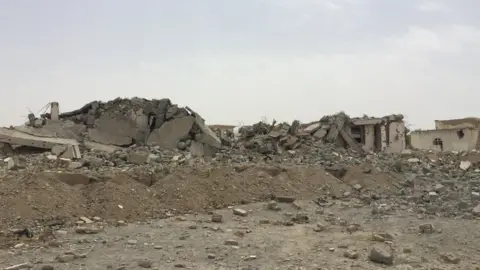 Bomb damage at the police station in Sangin