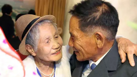 EPA LeeKeum-seom (L), 92, of South Korea meets with her North Korean son Lee Sung-chul (R), 71, during the inter-Korean family reunions at the Mount Kumgang resort, North Korea, 20 August 2018