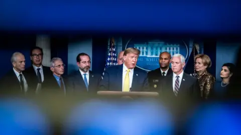 Getty Images Trump briefs the press on the US coronavirus response