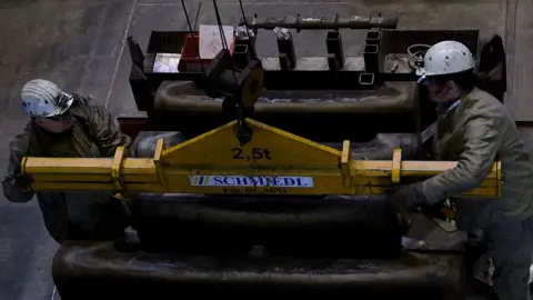 Getty Images Workers at a ThyssenKrupp steel plant