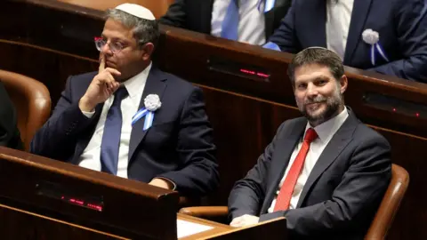 Reuters Itamar Ben-Gvir (L) and Bezalel Smotrich (R) sit in the Israeli parliament on 15 November 2022