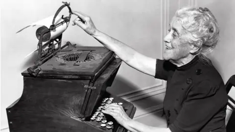 Getty Images Christopher Latham Sholes' daughter Lillian Sholes Fortner demonstrating her father's typewriter in 1939