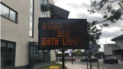 BBC Traffic directions near Queen's Road in Belfast