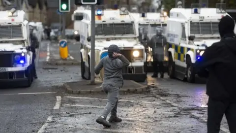 EPA Nationalist youths clash with police in West Belfast