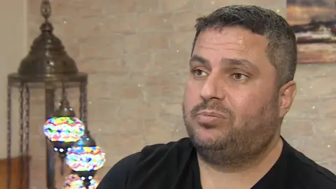 A screengrab of Cengiz Akarsu appearing in a BBC news report