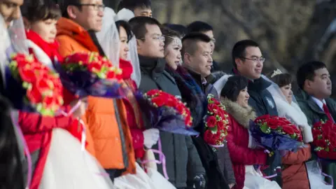 Getty Images A group wedding ceremony in Heilongjiang, China in 2015