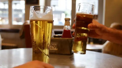 PA Media Two pints of lager