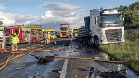 M6 near Carlisle reopens after lorry fire melts road surface