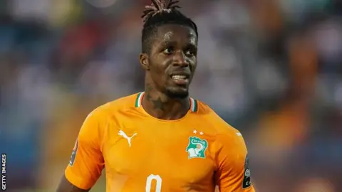 Getty Images Wilfried Zaha in action for Ivory Coast
