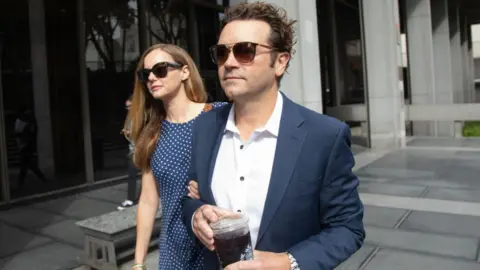 Getty Images Actor Danny Masterson arrives at Clara Shortridge Foltz Criminal Justice Center in Los Angeles, CA on Wednesday, May 31, 2023 with wife Bijou Phillips