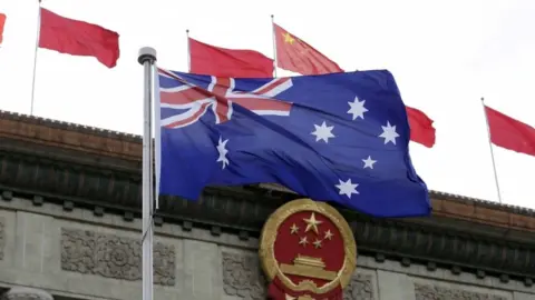 Reuters An Australian flag in front of Chinese flags