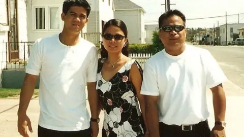 Courtesy Aimee Beboso Aimee and her brothers pictured in front of their first house in Timmins