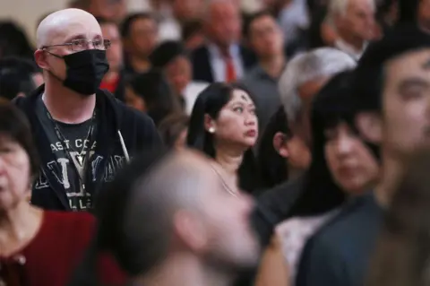 Getty Images Worshippers in St Agnes Church, New York City, last month