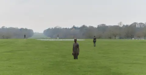 Sir Antony Gormley: Artist’s iron men take over grounds of Norfolk stately home
