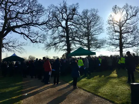 Mourners attending funeral service