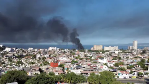 MoreLifeDiaries via Reuters Screengrab from a drone video showing black smoke rising in the sky
