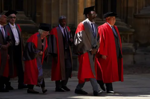 PA Media Sir Lenny Henry walks in a procession ahead of receiving an honorary degree from Oxford University at a ceremony at Sheldonian Theatre