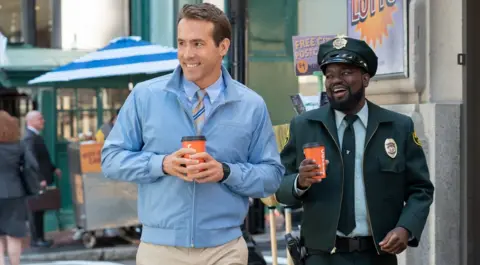 Alan Markfield Ryan Reynolds and Lil Rel Howery in Free Guy