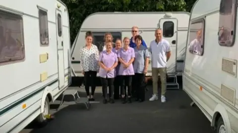 Nightingales Care Home Carers with gifted caravan