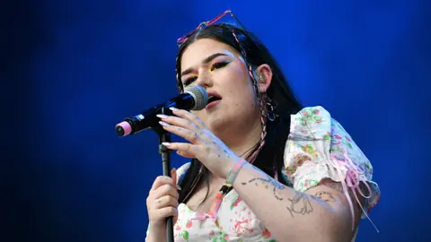 Getty Images Mae Stephens performing on stage