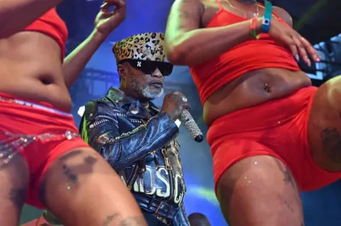 AFP Koffi Olomide performs on stage at the festival with dancers and back-up musicians on 12 September.