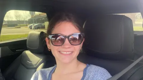 Corinn McKenna in her car