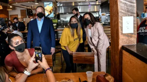 Getty Images Kamala Harris courts the Hispanic vote at a restaurant in Doral, Florida