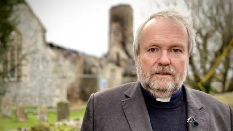 Martin Giles/BBC Archdeacon Hugh McCurdy