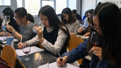 AFP/Getty Chinese students taste and study wine during a class on March 16, 2017 at the School of Wine of the Dijon Business School.