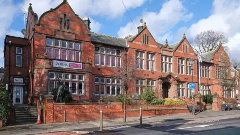 Altrincham Council Offices, a red bricked former town hall. 