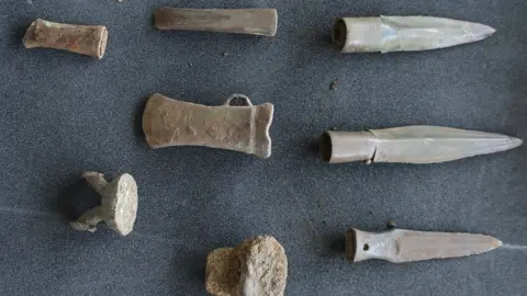 British Museum’s Portable Antiquities Scheme Hoard of spears, and a gouge, chisel and an axe and some metalworking waste