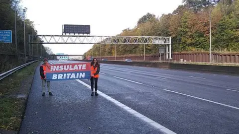 Insulate Britain Protesters walked alongside traffic on the M25 in Hertfordshire.