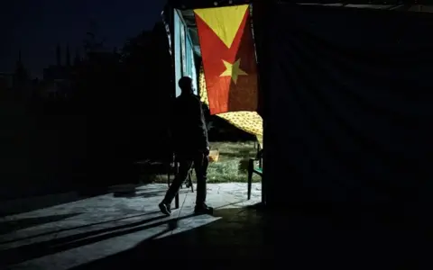 Getty Images Man walks out of polling station