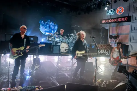 A shot of The Cure on stage at their Radio 2 concert, filmed at the BBC Radio Theatre in London