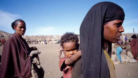 Getty Images Women and children at the Mekele refugee camp in Ethiopia in 1984