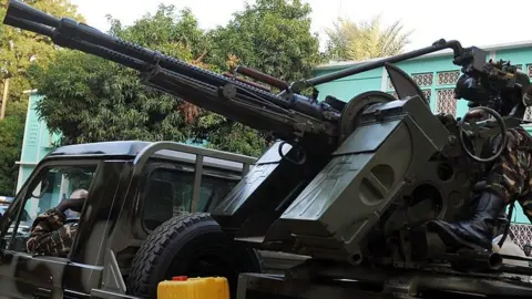 AFP A armoured vehicle by the presidential palace in Niamey, Niger - archive shot