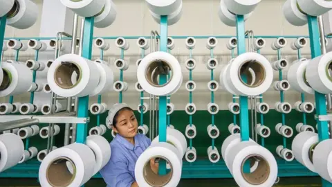 Getty Images Chinese worker in factory