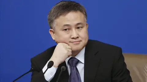 Getty Images Pan Gongsheng attends a press conference in Beijing, China.