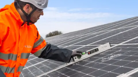 Network Rail A man installing a solar roof