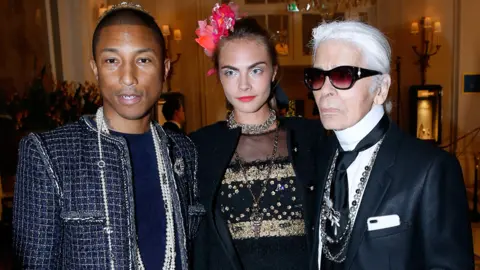 Getty Images Pharrell Williams, Cara Delevingne and Karl Lagerfeld attend the "Chanel Collection des Metiers d'Art 2016/17 : Paris Cosmopolite