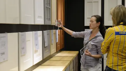 Getty Images Ikea shop worker and customers