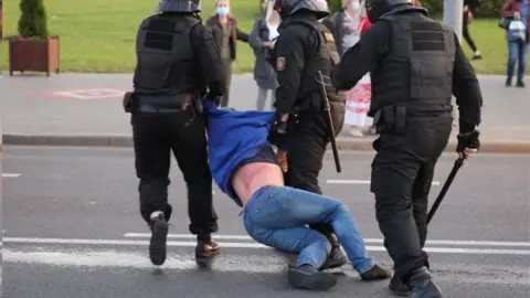 Reuters Riot police detain a demonstrator in Minsk, Belarus. Photo: 23 September 2020