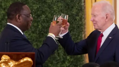 US President Joe Biden (R) and President of Senegal Macky Sall (L) offer toasts at the US-Africa Leaders Summit dinner in the East Room of the White House in Washington, DC, USA, 14 December 2022.