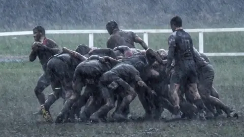 PAUL HAWES muddy rugby players