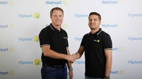 Reuters Flipkart co-founder and chief executive Binny Bansal (right) with Walmart chief Doug McMillon