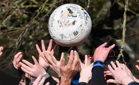 AFP/Getty Images Players reach for the ball